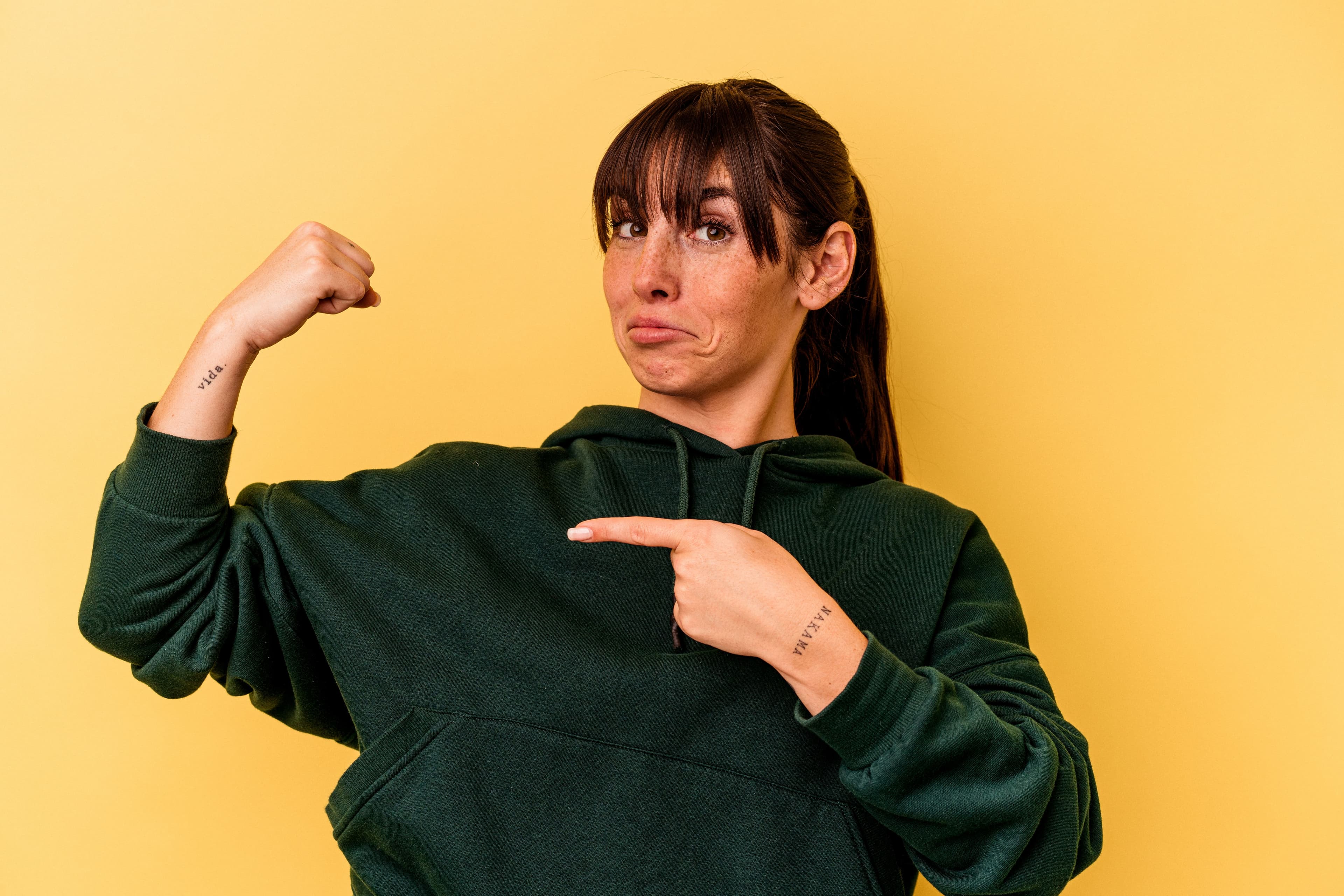 Confident young woman showcasing strength and vitality, symbolizing the importance of hormonal balance and optimal health.