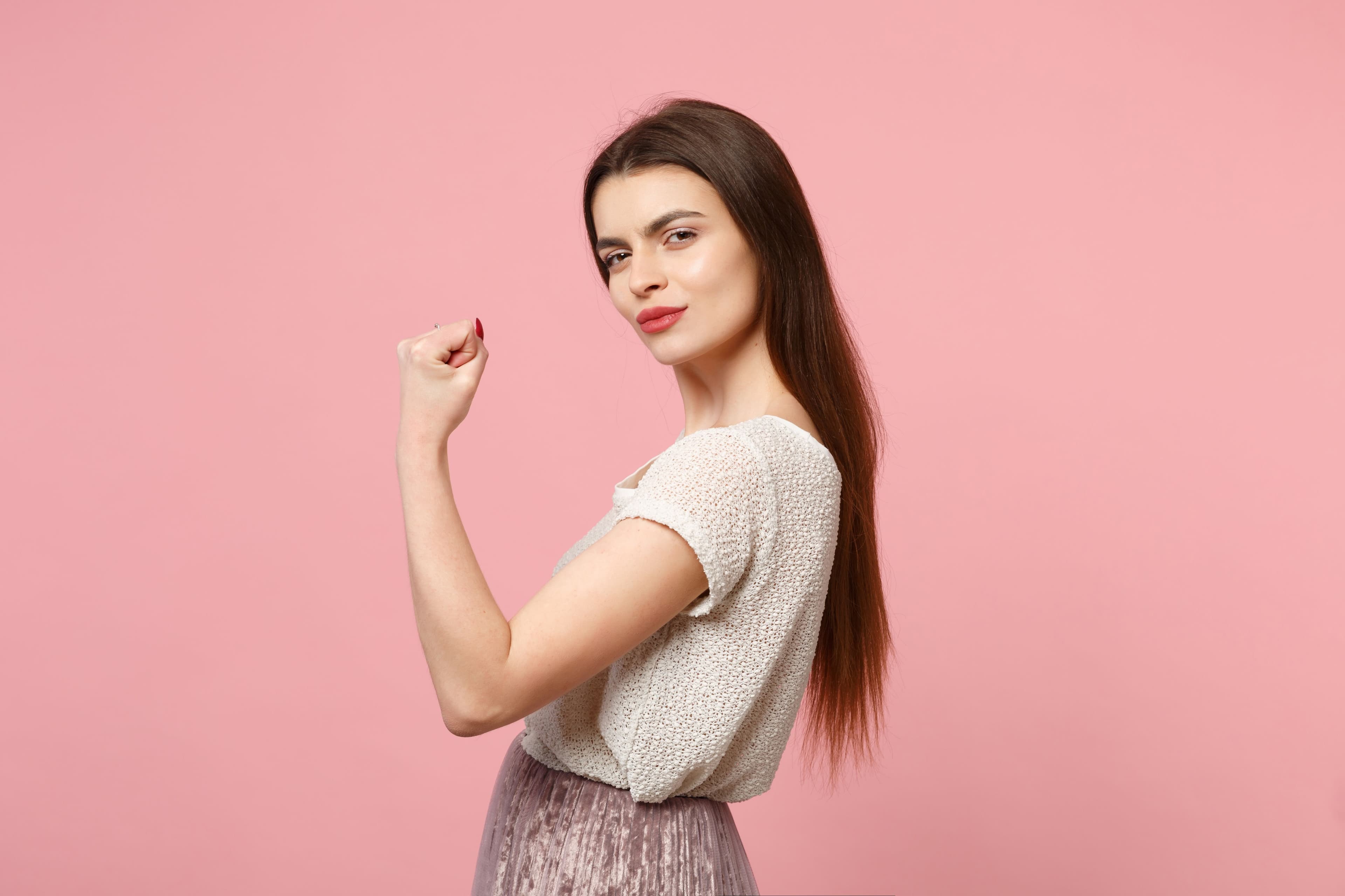 Healthcare professional performing a saliva hormone test on a female patient to evaluate hormonal balance